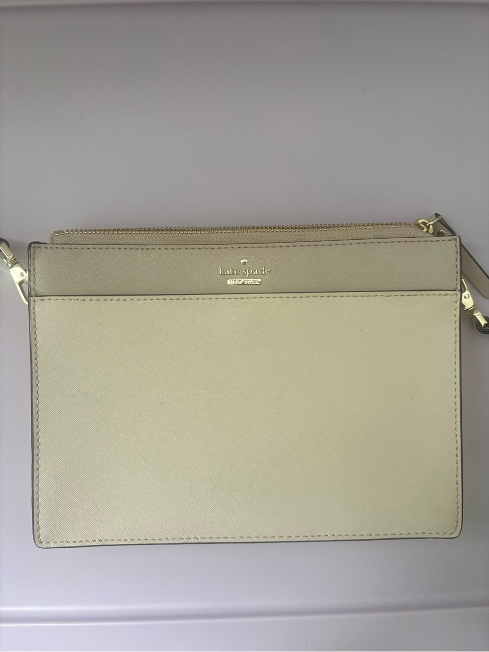 kate spade cream leather wristlet with gold hardware